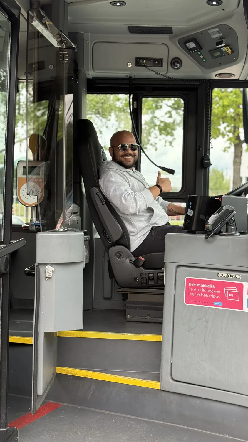 Ekansh Sharma in the driver's seat of a hydrogen bus